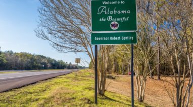 Road sign the says welcome to Alabama the beautiful governor Robert Bentley