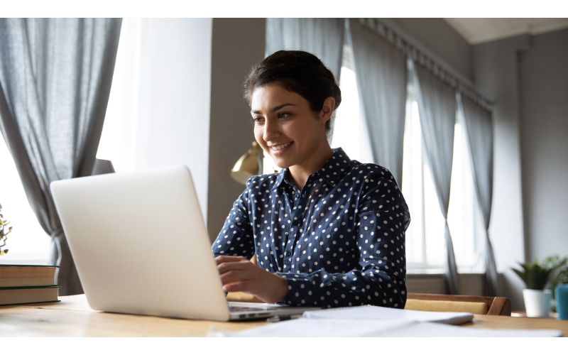 Woman working remotely from her desktop computer