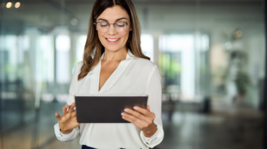 Executive woman holding a tablet.