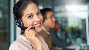 Woman receiving calls with her team of independent insurance agents.