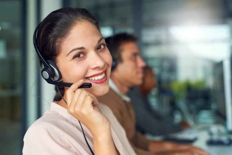 Woman receiving calls with her team of independent insurance agents.