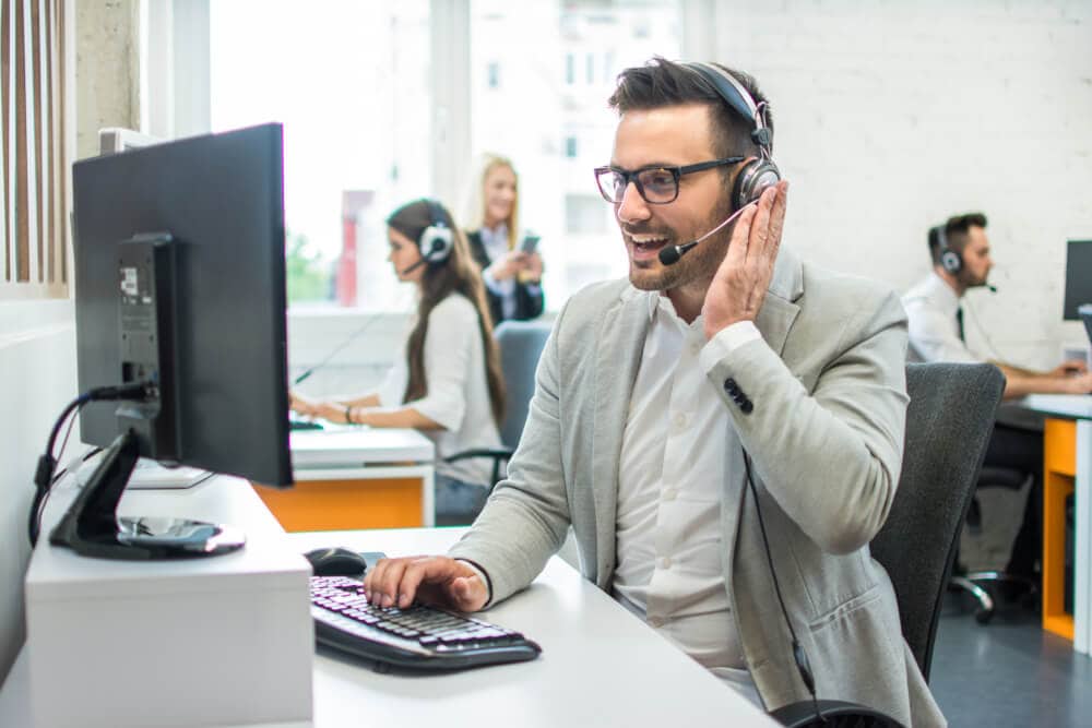 Hispanic man receiving calls from an insurance customer service.