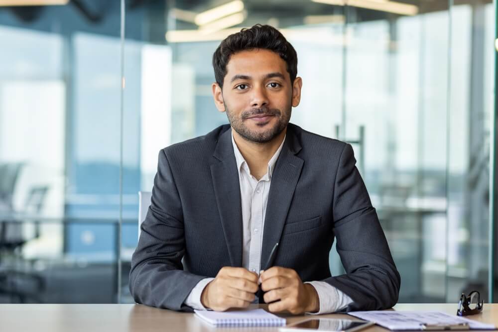 Man sitting and thinking about how to become a successful independent insurance agent
