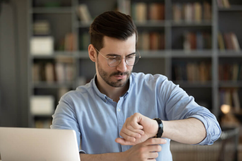 Man watching his clock - Time Management - Bluefire