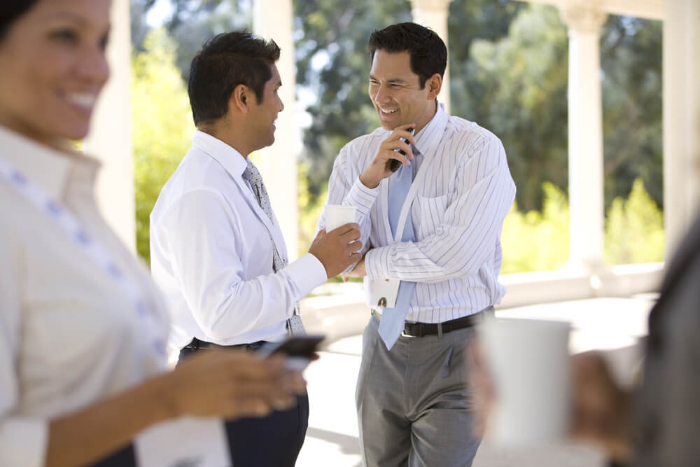 Business men and women gather for coffee in California.